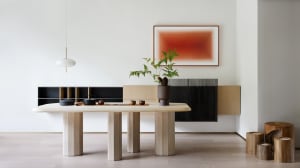 A modern interior design featuring a wooden living room with minimalist furniture, a large abstract painting, and a minimalis