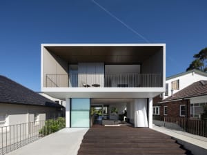 A modern house featuring glass, metal, and concrete materials.