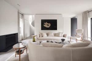 White living room with modern furniture and minimalist decor.