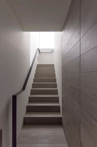 Modern staircase with wooden steps and metal railings