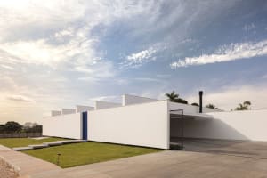 Modern architectural design with minimalist aesthetic, featuring concrete construction.