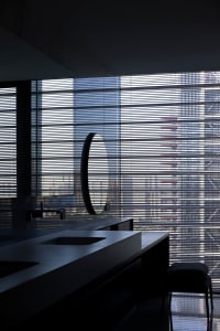 A modern interior with a glass window and minimalist design.