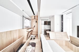 Modern minimalist residential interior with wooden walls and furniture.