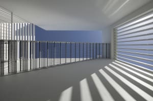A modern building featuring a metal grid design on its exterior.