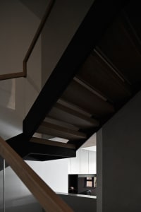 Modern staircase with wooden steps and steel railings