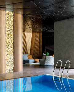 Indoor spa featuring a swimming pool with a modern industrial design and wooden accents.