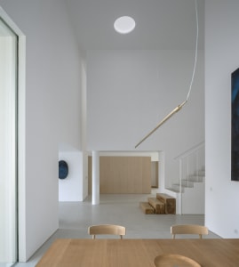 Modern, minimalist interior design with wood, concrete, and glass materials.