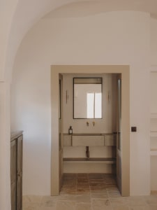 A modern bathroom featuring minimalist design with granite materials.