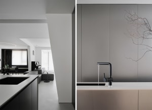 Modern minimalist kitchen featuring concrete countertops and minimalist design elements.
