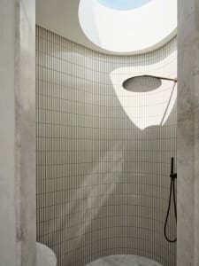 Modern bathroom with marble and glass materials