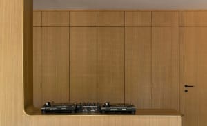 A modern home studio with wooden walls and a sleek, contemporary design.