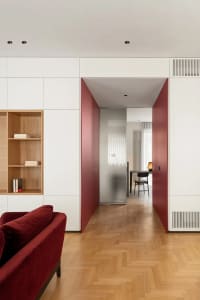 Modern office space featuring wood flooring and furniture.