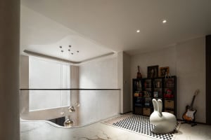 A modern living room featuring marble and glass materials.