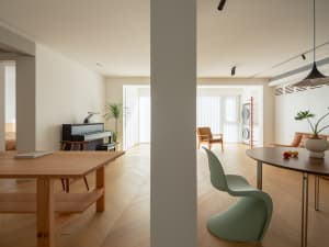 Modern living room with wooden furniture and minimalist design.