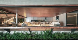 Modern living room with wooden flooring and contemporary furnishings.