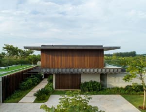 Modern minimalist residential architecture featuring wood, concrete, and glass materials