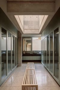 Modern bathroom with concrete and glass elements