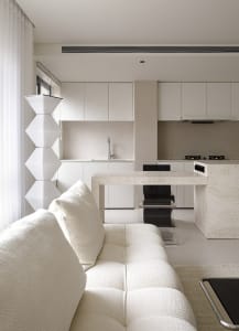 Modern minimalist kitchen with white marble countertops
