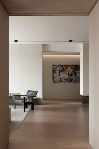 A minimalist desk in a modern interior design setting.