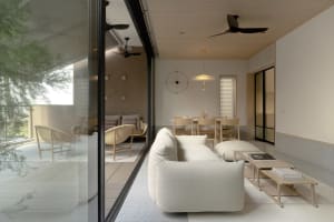 Modern minimalist living room featuring contemporary furniture and neutral color palette