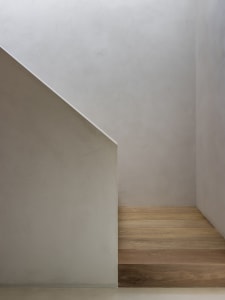 Minimalist modern stairwell clad in concrete