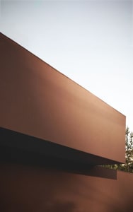 Modern exterior featuring a wall made of concrete