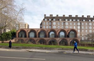 Urban architecture featuring brick and glass windows.