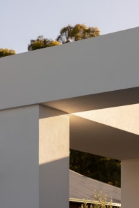 A modern residential building constructed with concrete materials.
