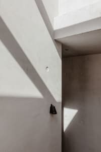 Modern minimalist interior with clean concrete walls and geometric forms
