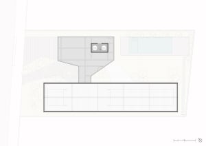 A modern floor plan featuring a concrete structure with a rectangular layout and a central open space.