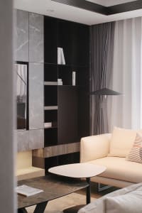 A modern living room with marble floor and black accents