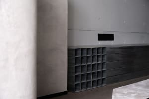 Minimalist design featuring metal panels in a modern interior setting.