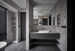Modern bathroom with a sleek marble countertop and minimalist design.