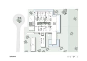 A detailed architectural floor plan of a modern office space on paper.