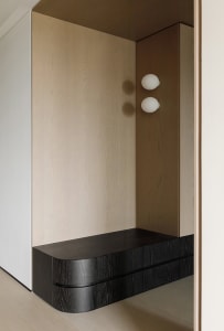A minimalist interior design featuring wooden materials.