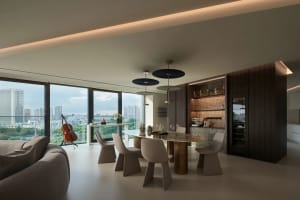 Modern living and dining area featuring sleek steel materials.