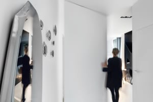 A minimalist apartment with white walls.
