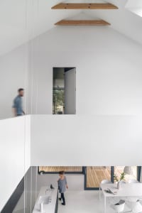 A modern white concrete living space with minimalist design.