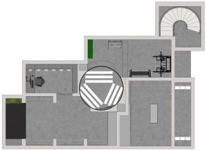 A detailed architectural floor plan of an industrial workspace featuring exposed concrete flooring.