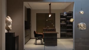 Modern kitchen with metallic finishes, featuring sleek design elements and contemporary fixtures.
