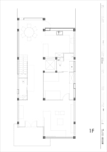 Modern residential floor plan showing the layout of a house's ground floor with a living room, dining area, kitchen, bathroom