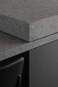 Close-up of a modern kitchen featuring a sleek granite countertop.
