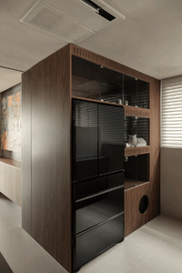 Modern kitchen with black refrigerator and wooden cabinets