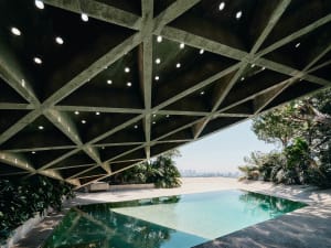 An architectural image showcasing a modern residential interior with concrete materials.