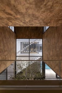 Modern interior space featuring contemporary design with wood materials.