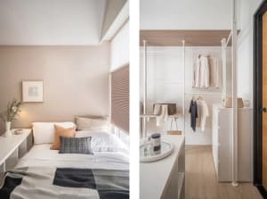 A minimalist bedroom featuring a walk-in wardrobe with a white shelf and hanging clothes, complemented by a white bed with ne