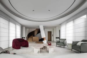 Modern interior design featuring marble furniture and circular ceiling.