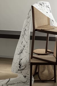 An abstract paper design hanging in a home office environment.