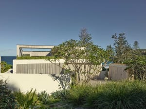 A modern residential building with concrete and wood architectural elements