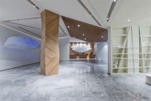Modern designed hotel lobby featuring concrete walls and flooring.
